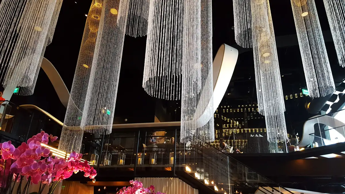 Crystal chandeliers and the two-level dining room inside Morimoto Asia