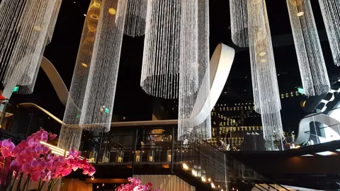 Crystal chandeliers and the two-level dining room inside Morimoto Asia